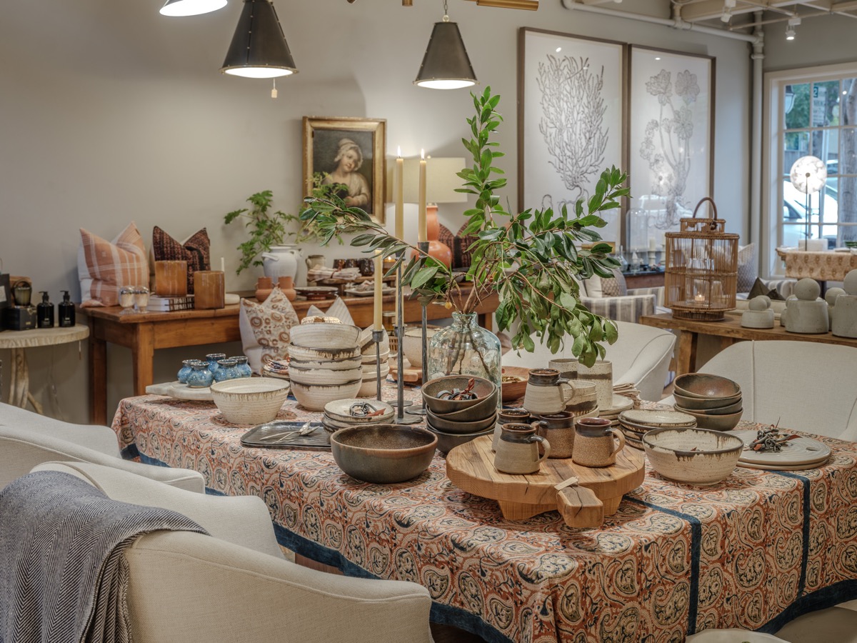 Dining table set with handmade ceramics and greenery at the Hart Habitats shop